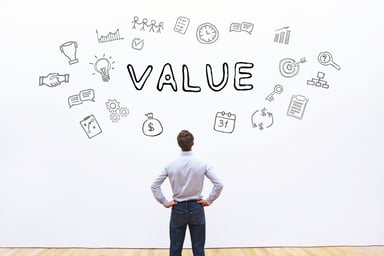 Man staring at Value written on wall