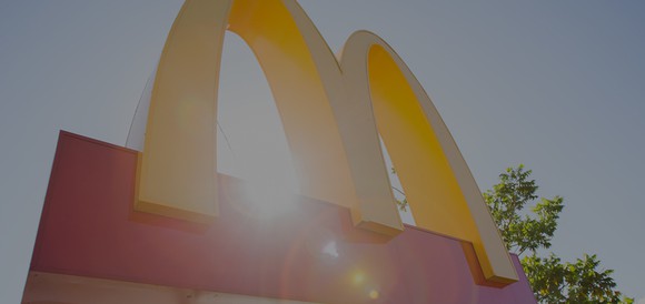 Exterior golden arches signage with bokeh photographic effect.