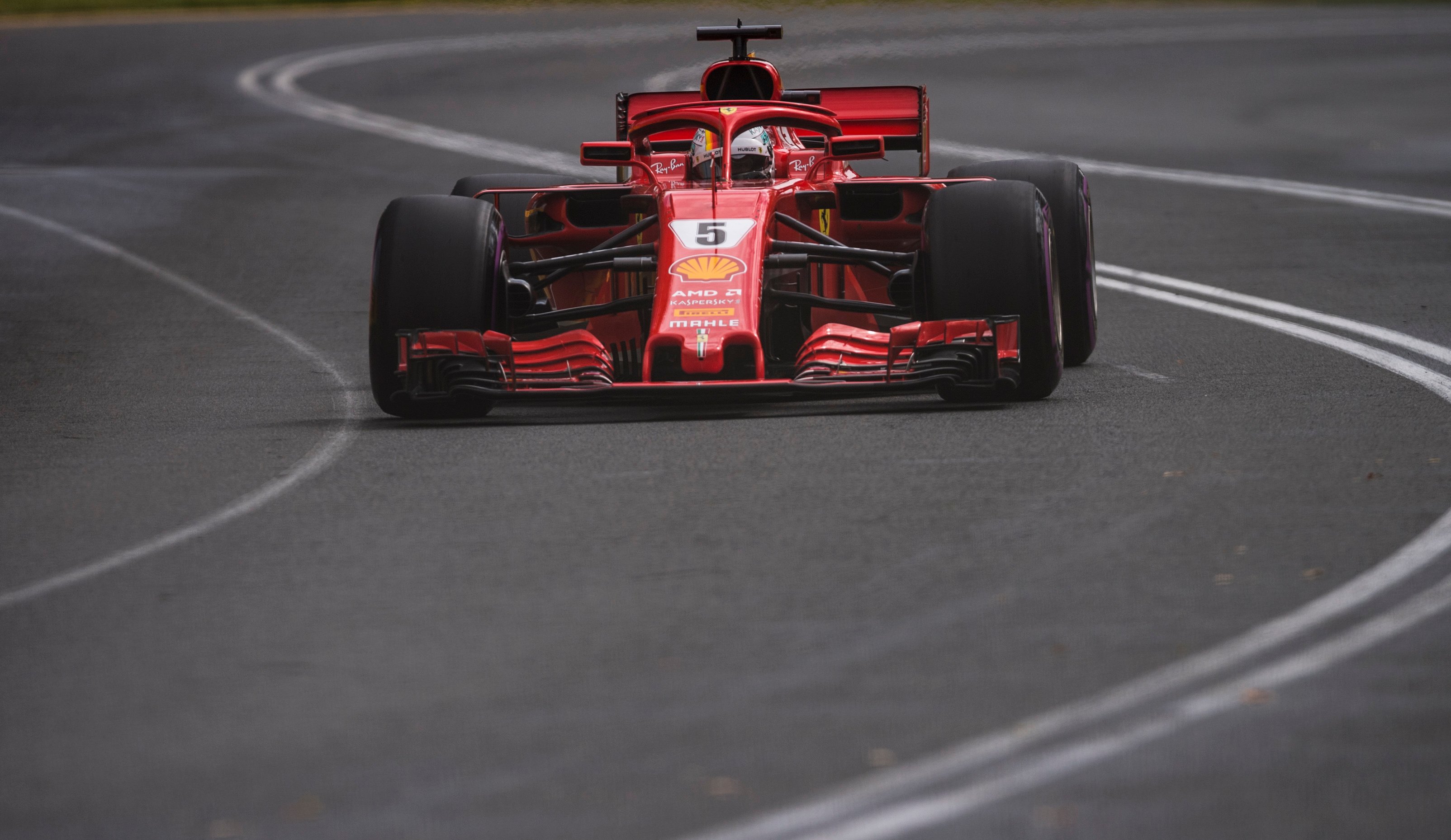 A red Ferrari Formula 1 racecar wearing the number 5 is shown on-track during the Australian Grand Prix on March 25, 2018. 