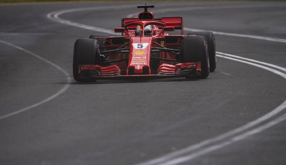 A red Ferrari Formula 1 racecar wearing the number 5 is shown on-track during the Australian Grand Prix on March 25, 2018. 