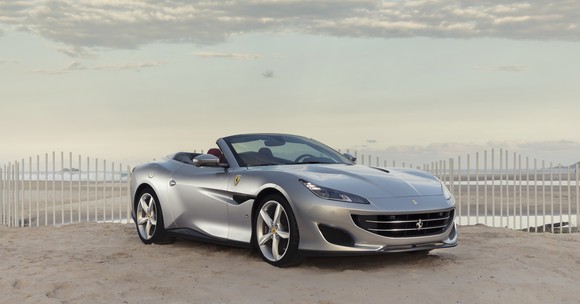 A silver Ferrari Portofino, a front-engined, four-seat convertible grand touring car.