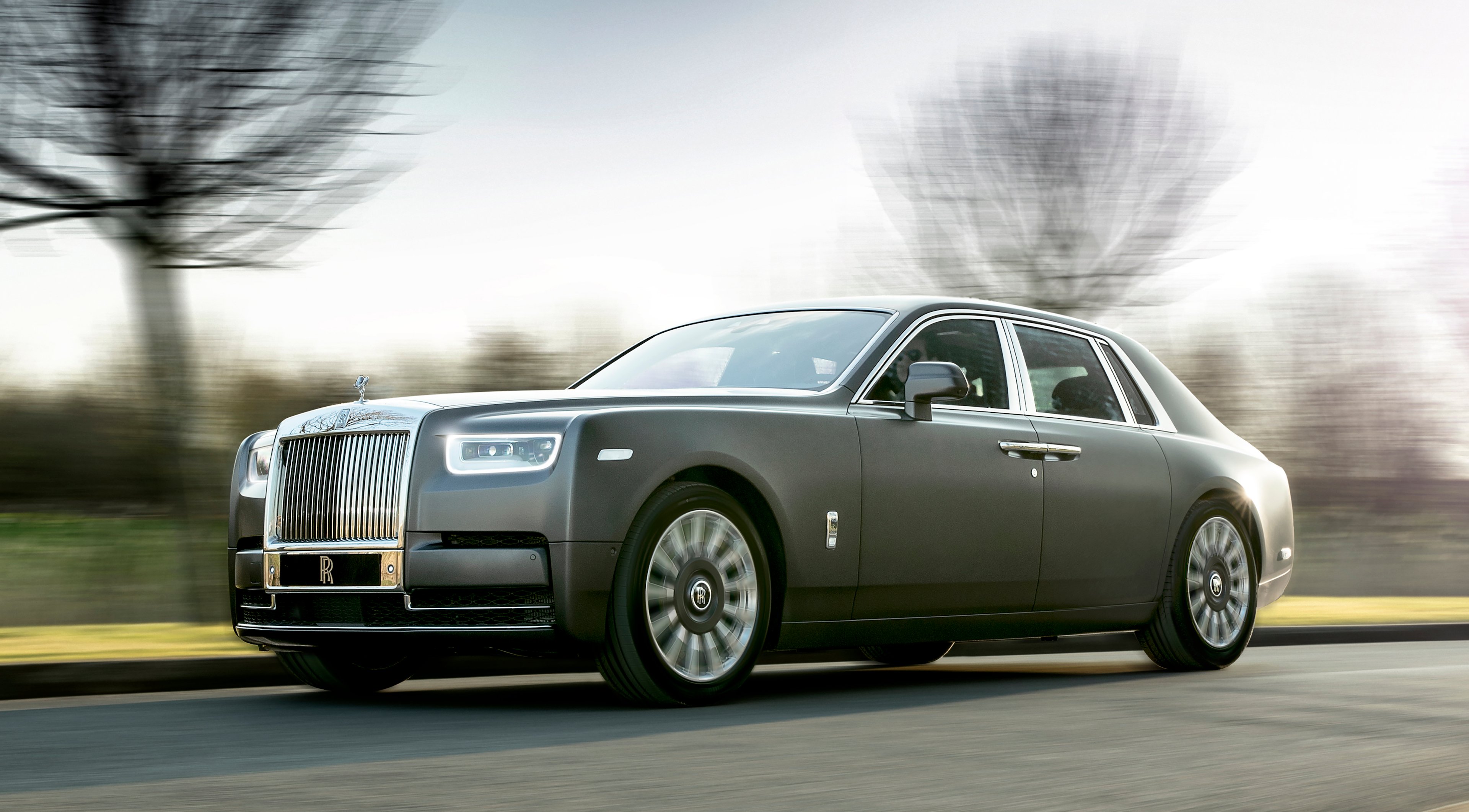 A dark gray 2018 Rolls-Royce Phantom, a large and opulent super-luxury sedan