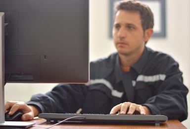 man working at computer_GettyImages-628194138