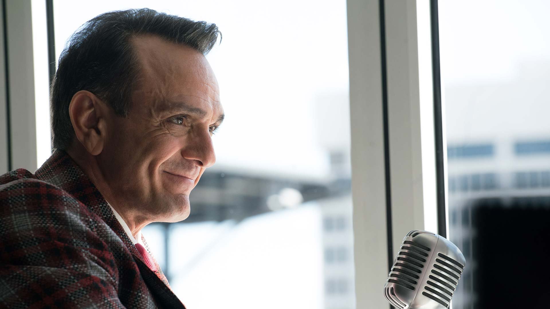 Close-up shot of a smiling Hank Azaria in the role of baseball player Jim Brockmire.