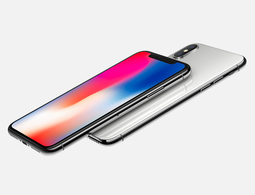 The Apple iPhone X featuring an OLED display. The screen has a rainbow of bright colors displayed.