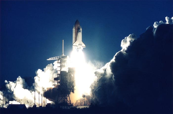 A space shuttle taking off.
