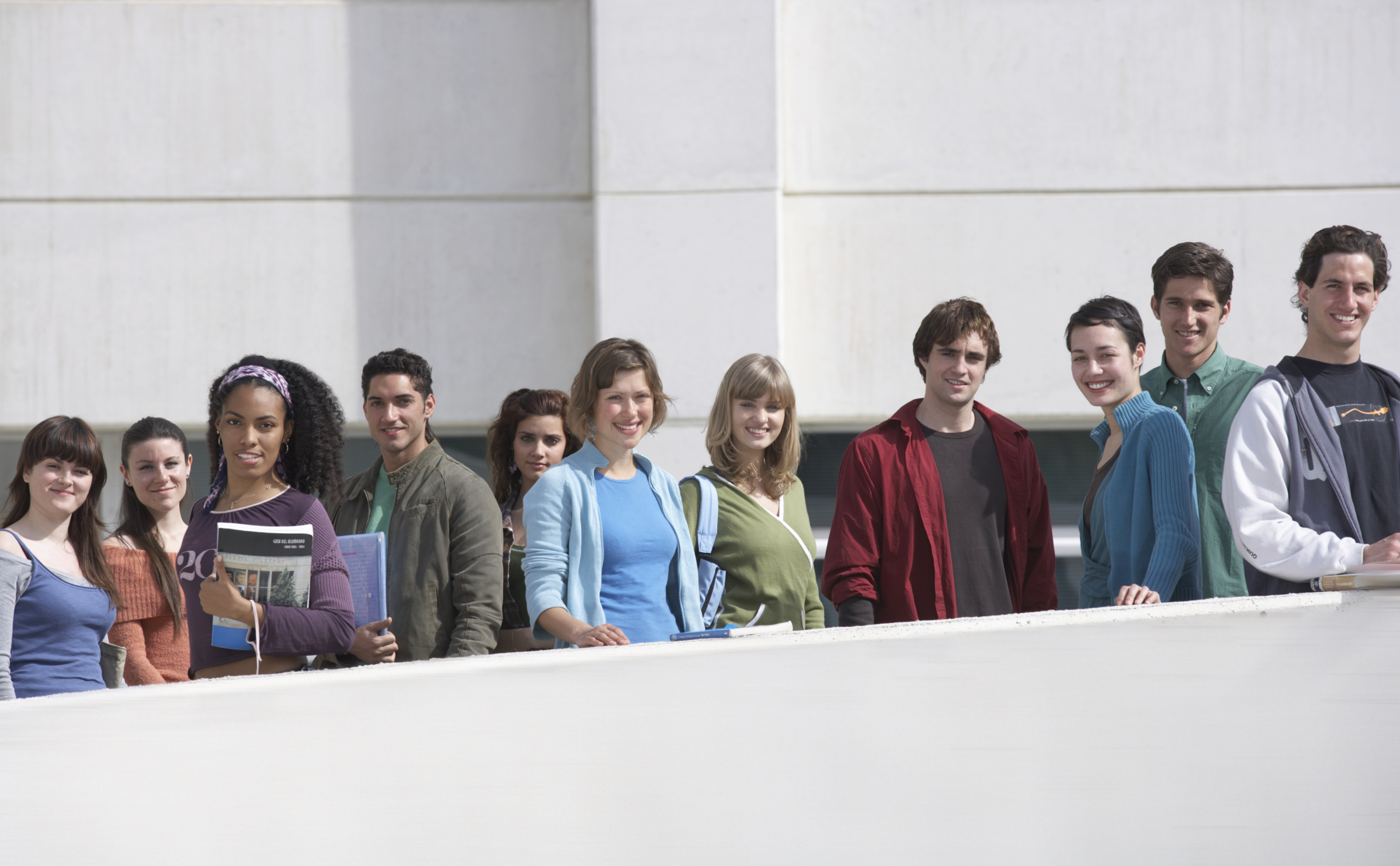 Group of 20-somethings standing side-by-side.