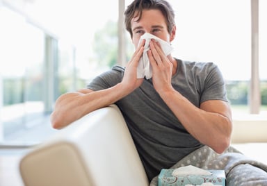 man blowing his nose_GettyImages-135385306