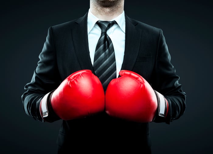 Businessman in boxing gloves. 
