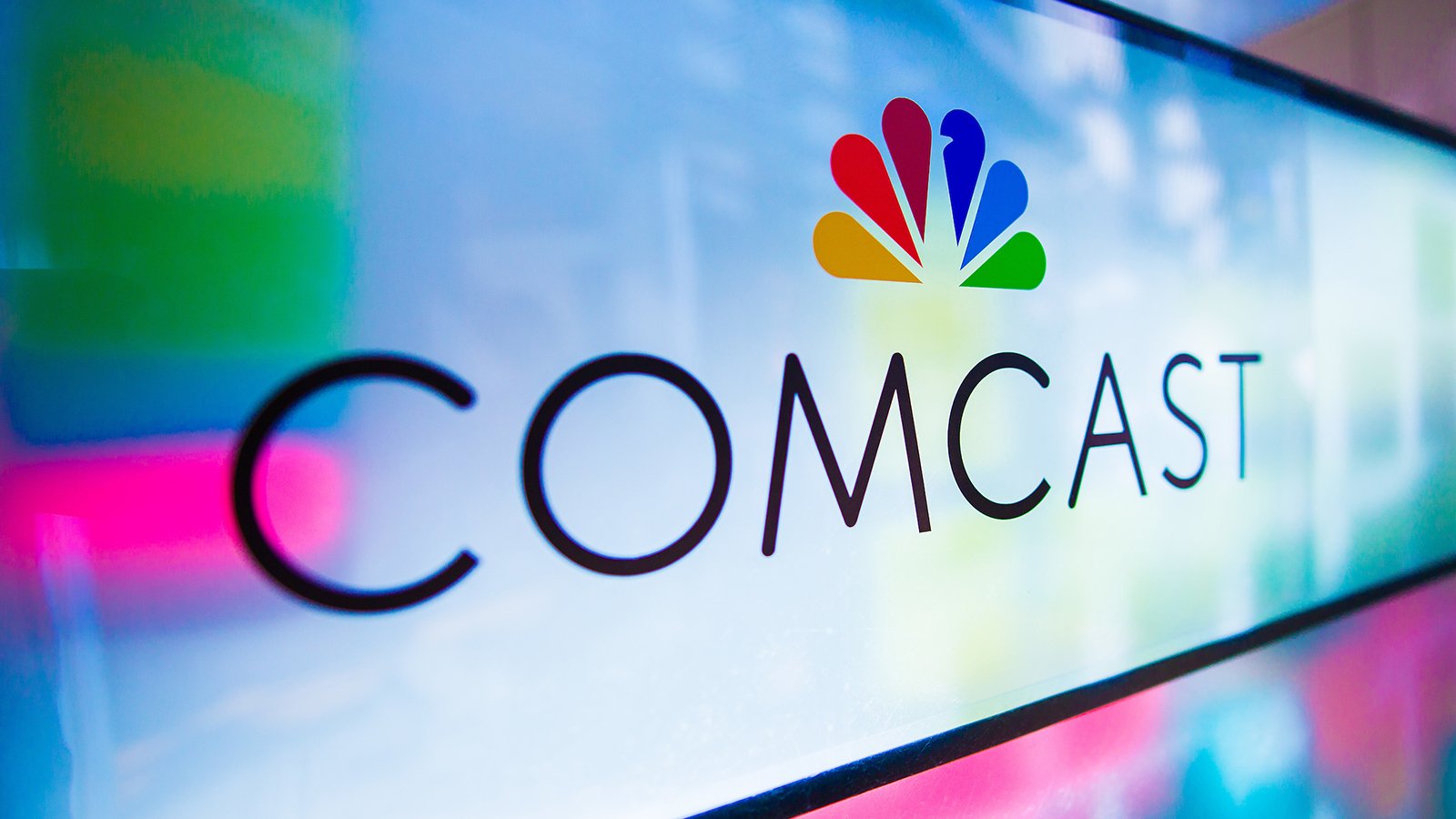 Comcast logo featuring the NBC peacock logo.