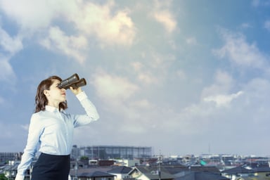 Binoculars -- woman overlooking