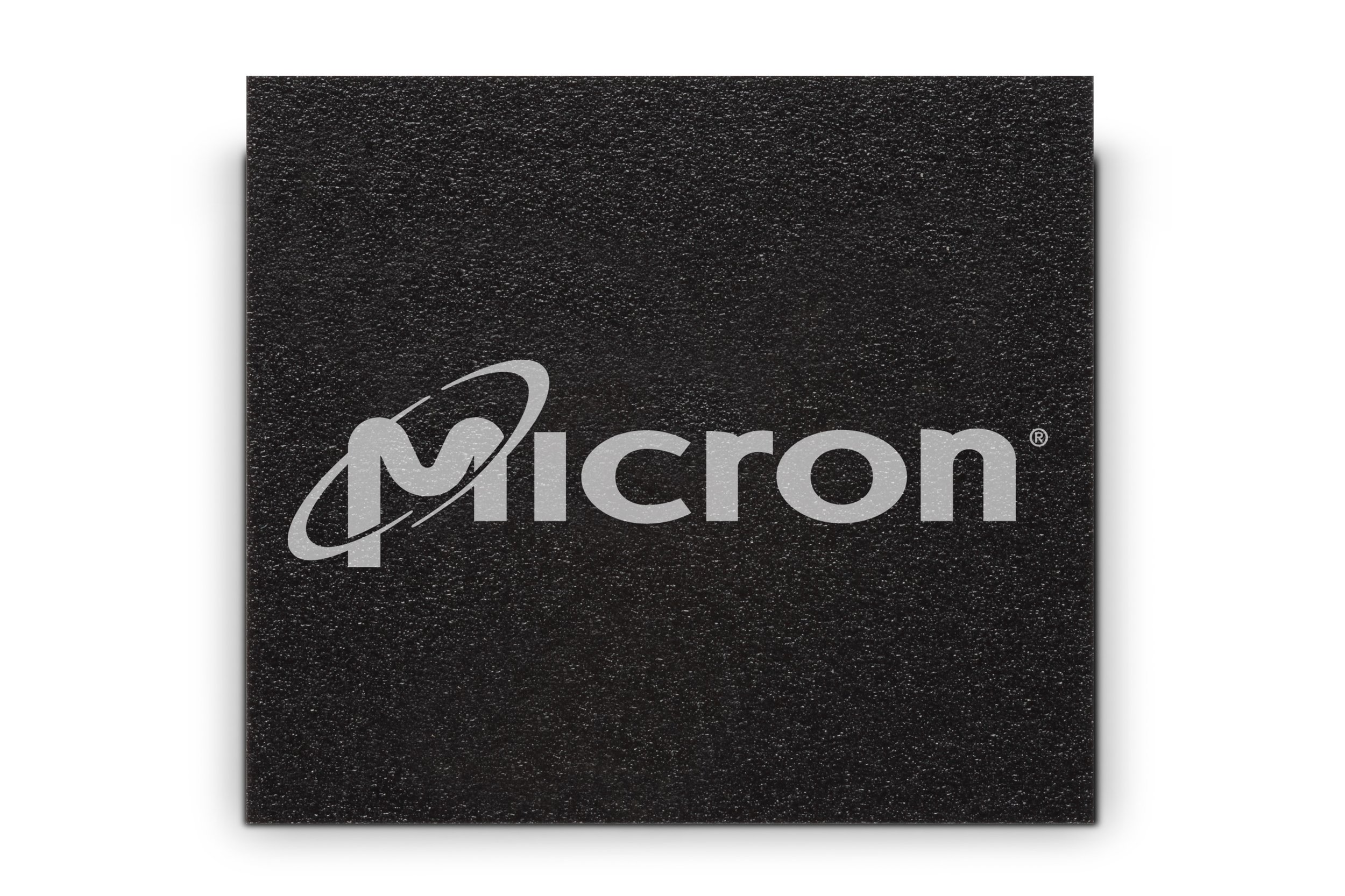 A black Micron NAND chip.
