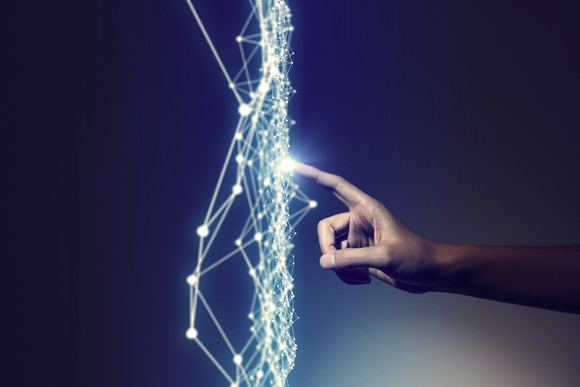 Finger touching lines that are lighting up.