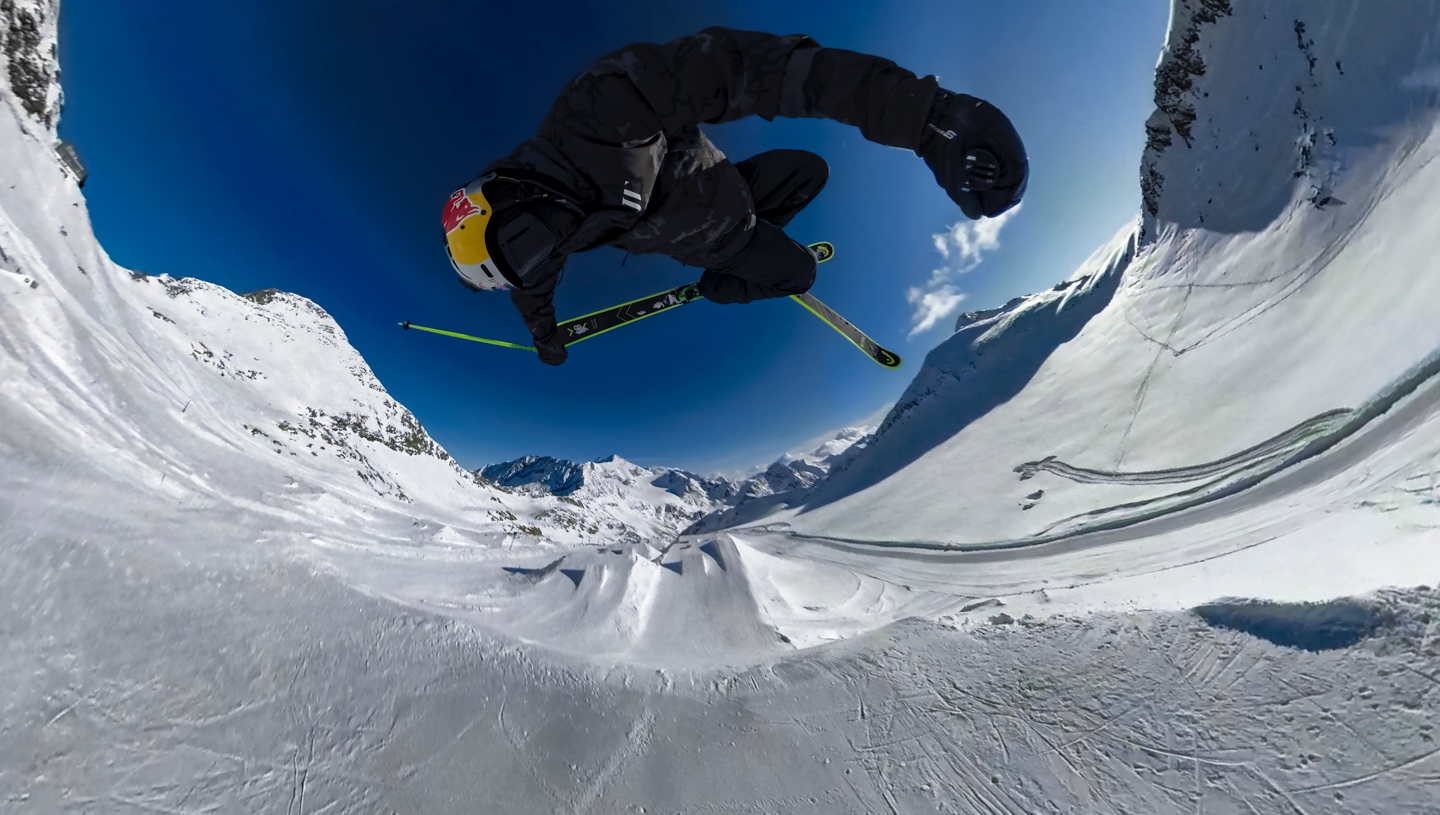 Spherical image of snowboarder on a mountain. 