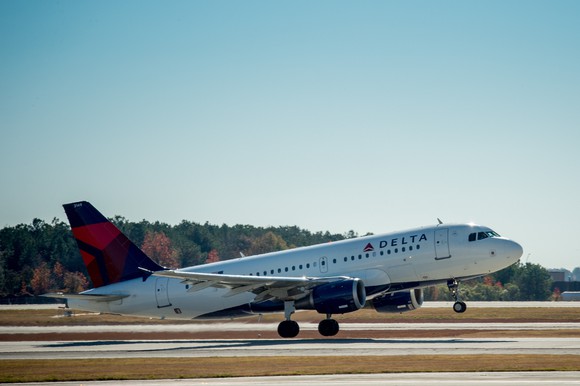 Delta aircraft taking off from runway