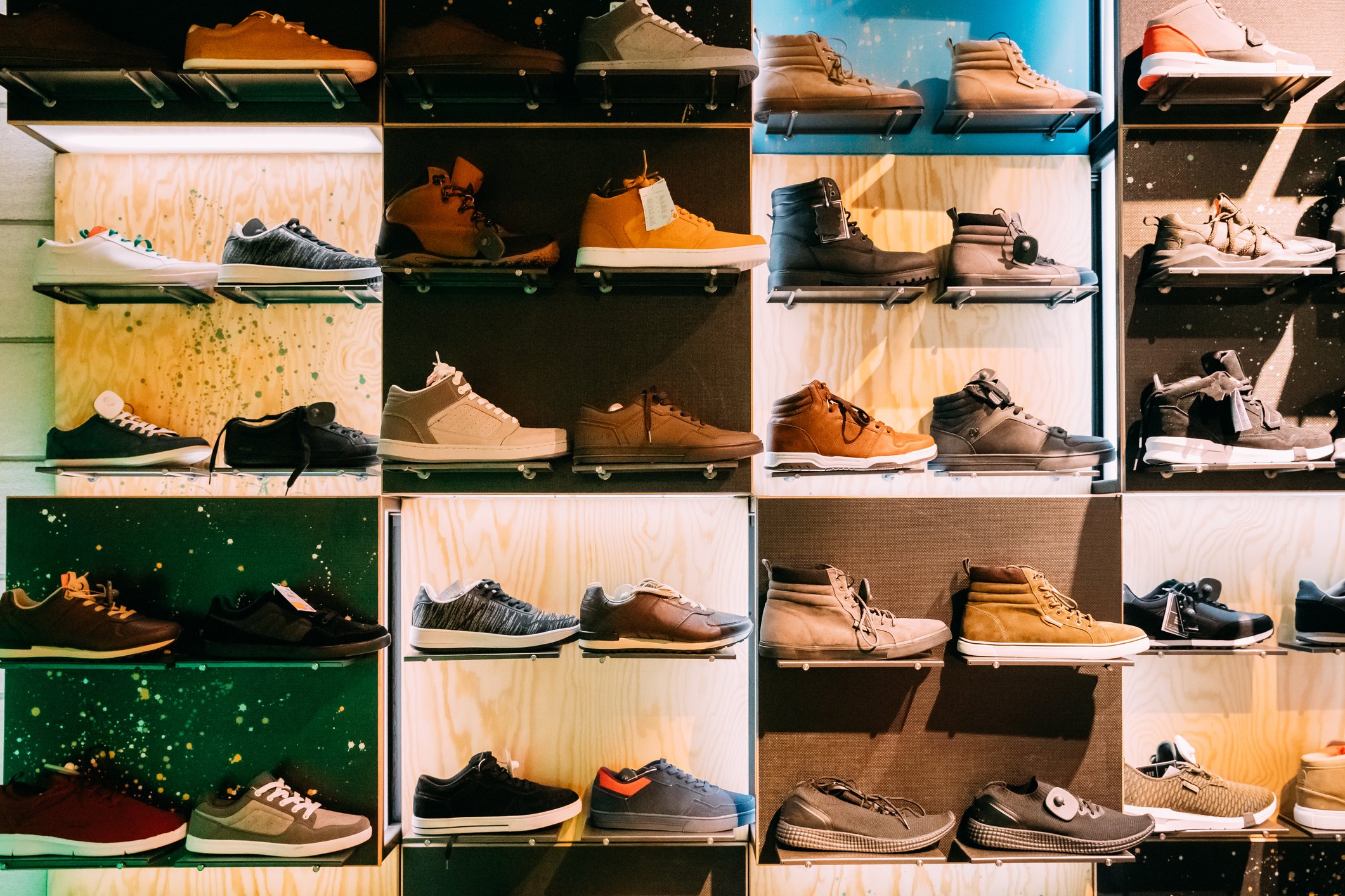 A wall of shoes in a shoe store.
