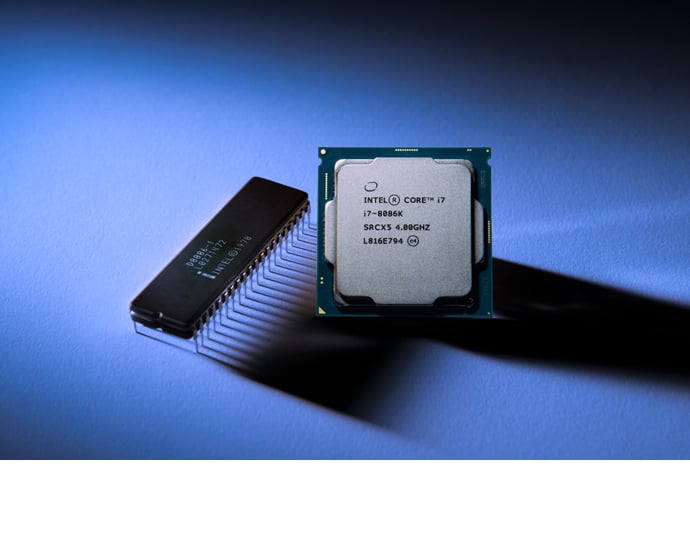 Intel's new Core i7-8086K chip next to Intel's original 8086 processor.