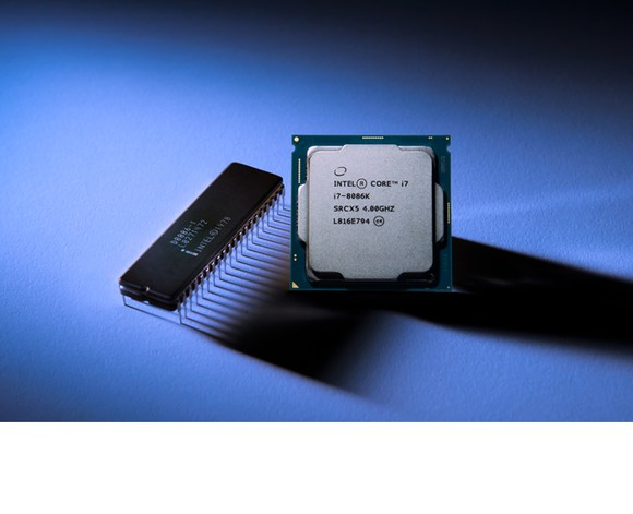 Intel's new Core i7-8086K chip next to Intel's original 8086 processor.