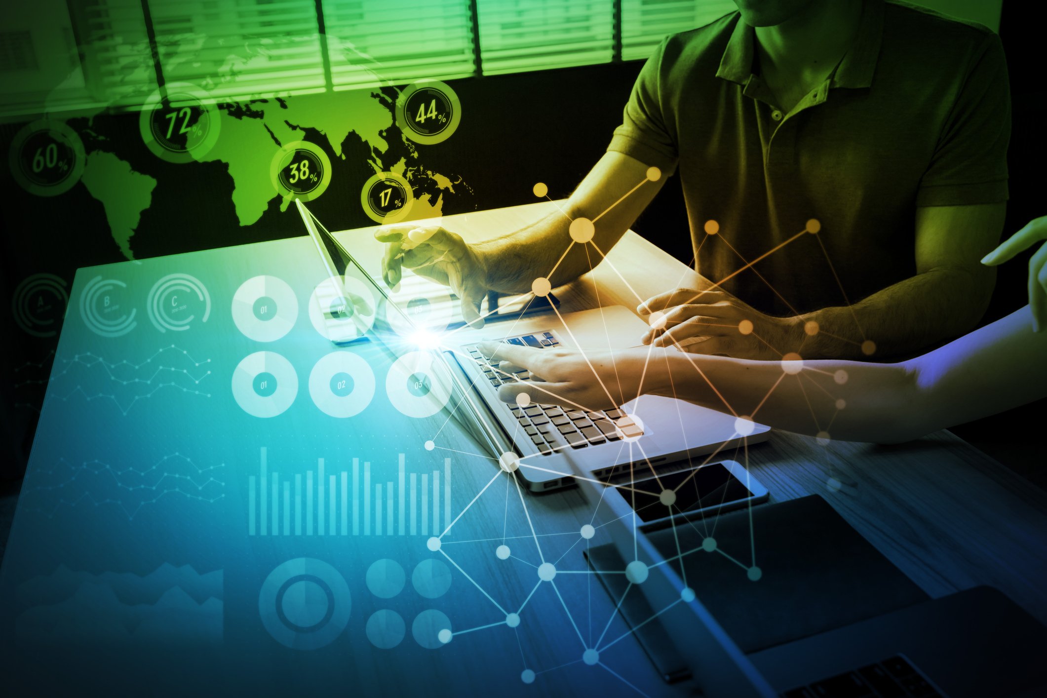 Two people working on a laptop, overlaid with a map of the world