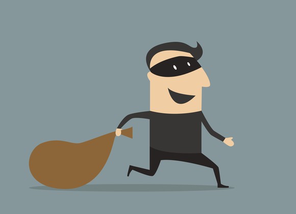 A drawing a of a robber holding a sack.