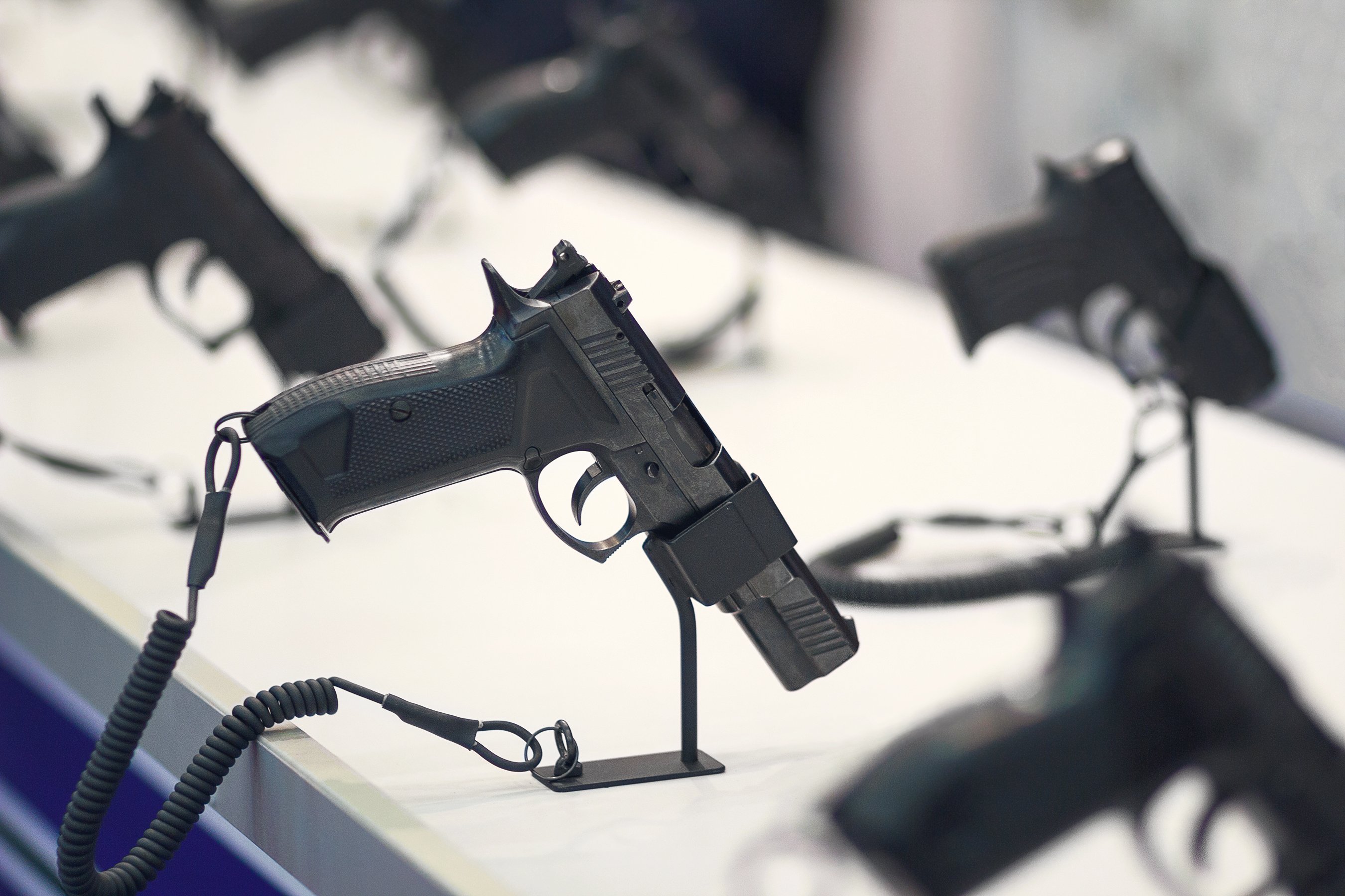 Different pistols models on store shelves.