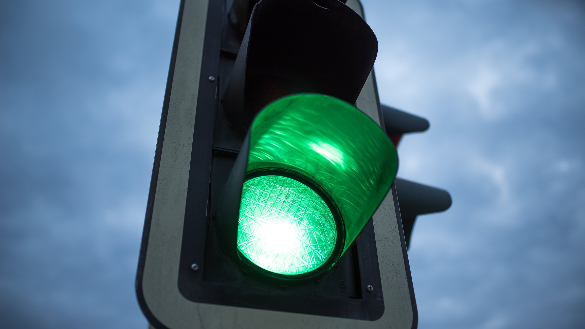 Green light on a traffic light.