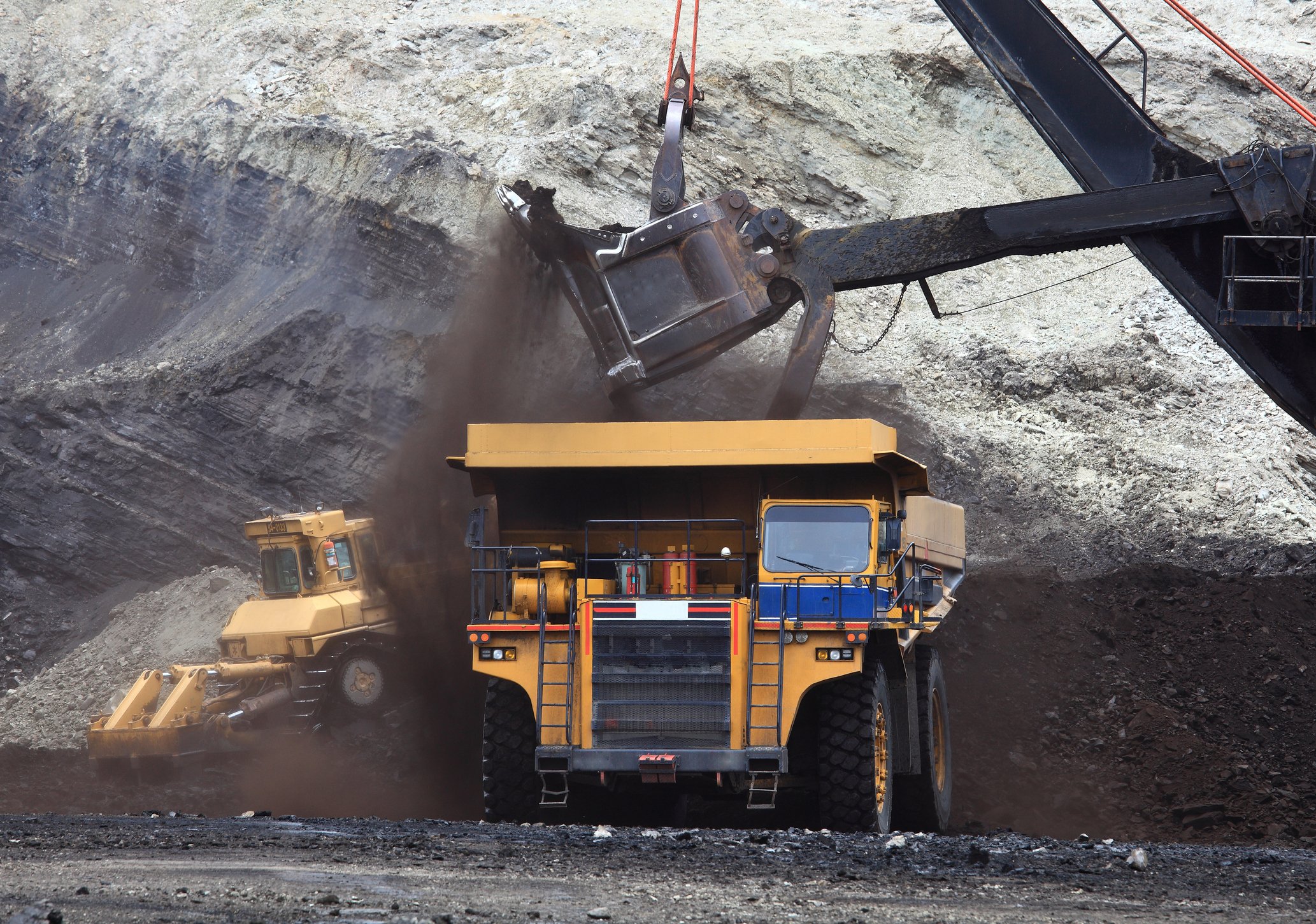 Mining excavator filling a dump truck.