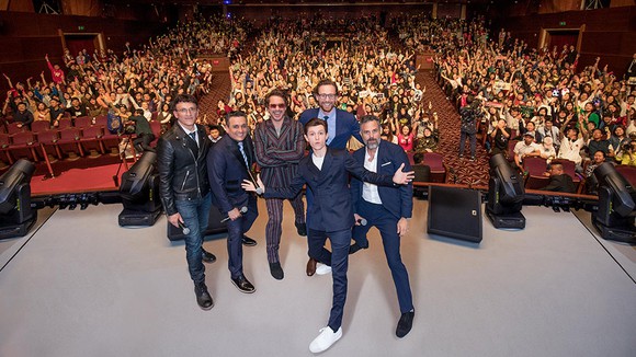 Avengers: Infinity War cast posing for a photo in front of an audience at the Shanghai Disney Resort.
