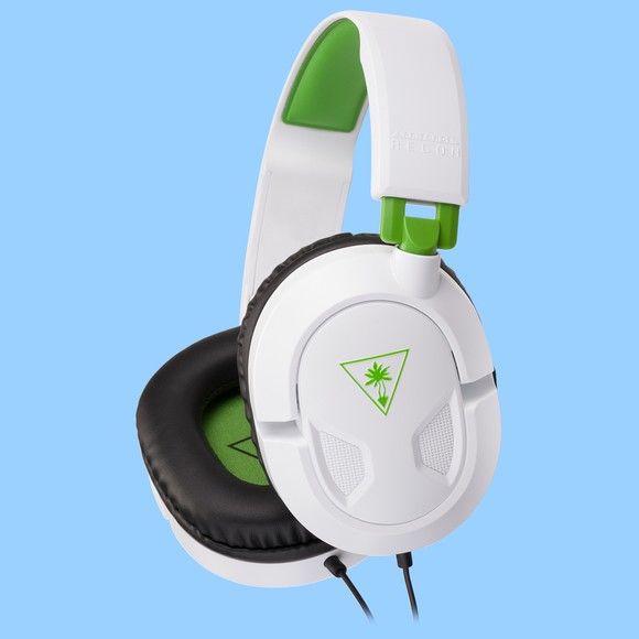 A white Turtle Beach Recon 50X headset with green accents.