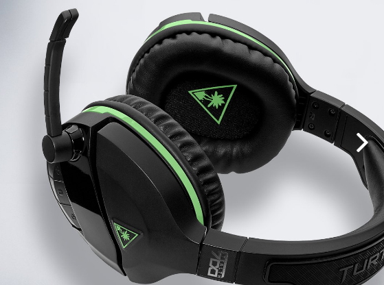 A pair of Turtle Beach's headsets lying on a flat surface.