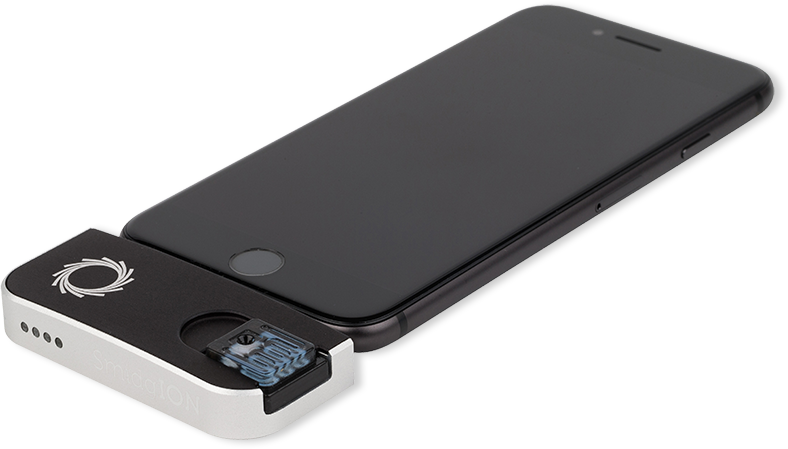 A smartphone with a SmidgION prototype attached.