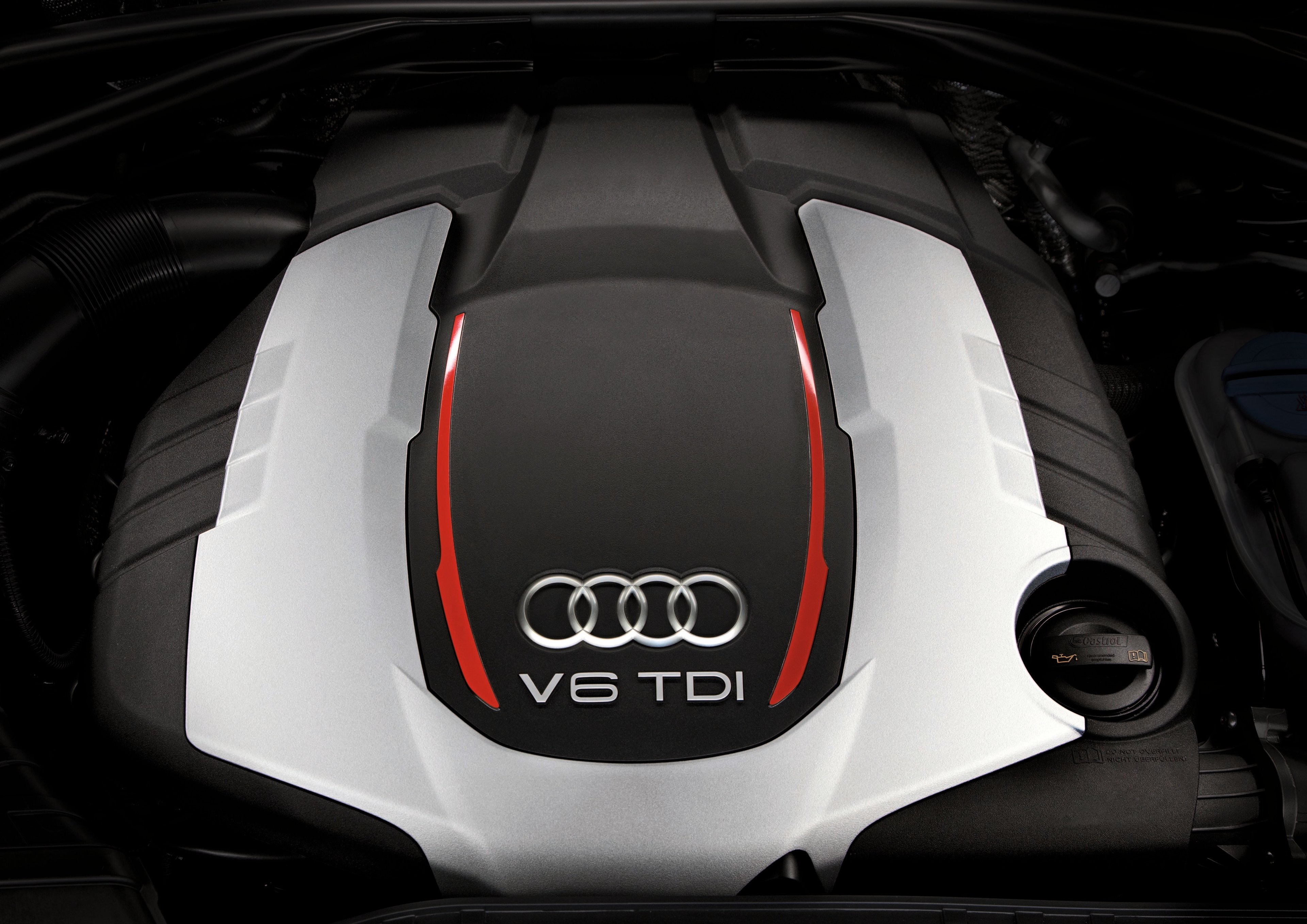 The top of an engine, showing Audi's four-rings logo and "V6 TDI".