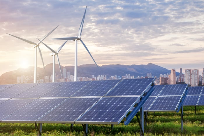 Wind turbines and solar panels.