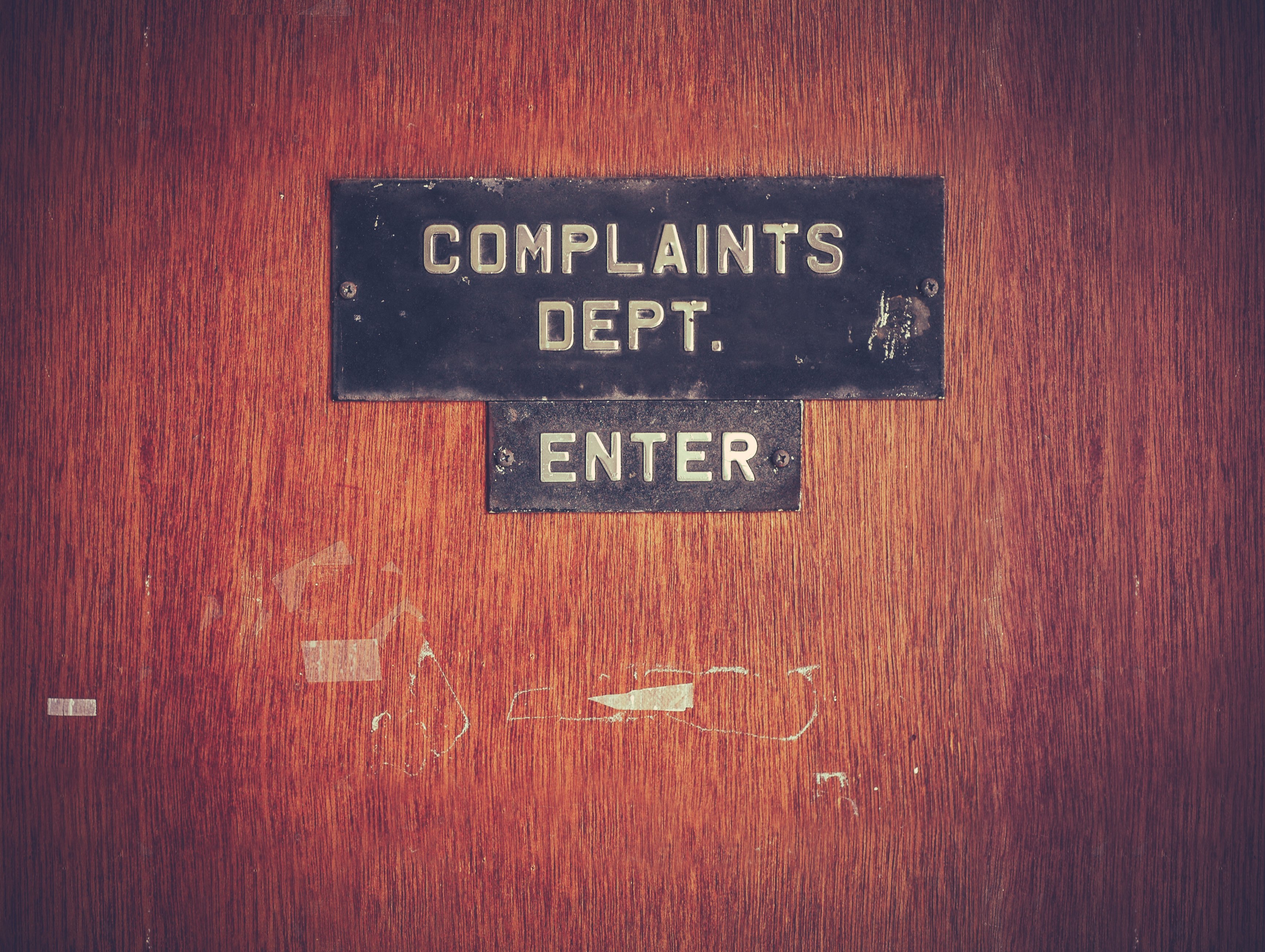 Door with complaints dept. lettering on it. 