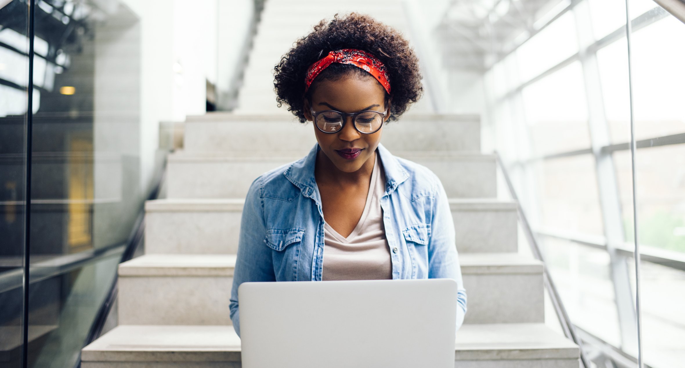 A woman using a laptop.