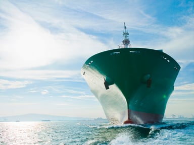 Bow View of Cargo Ship Sailing on Ocean