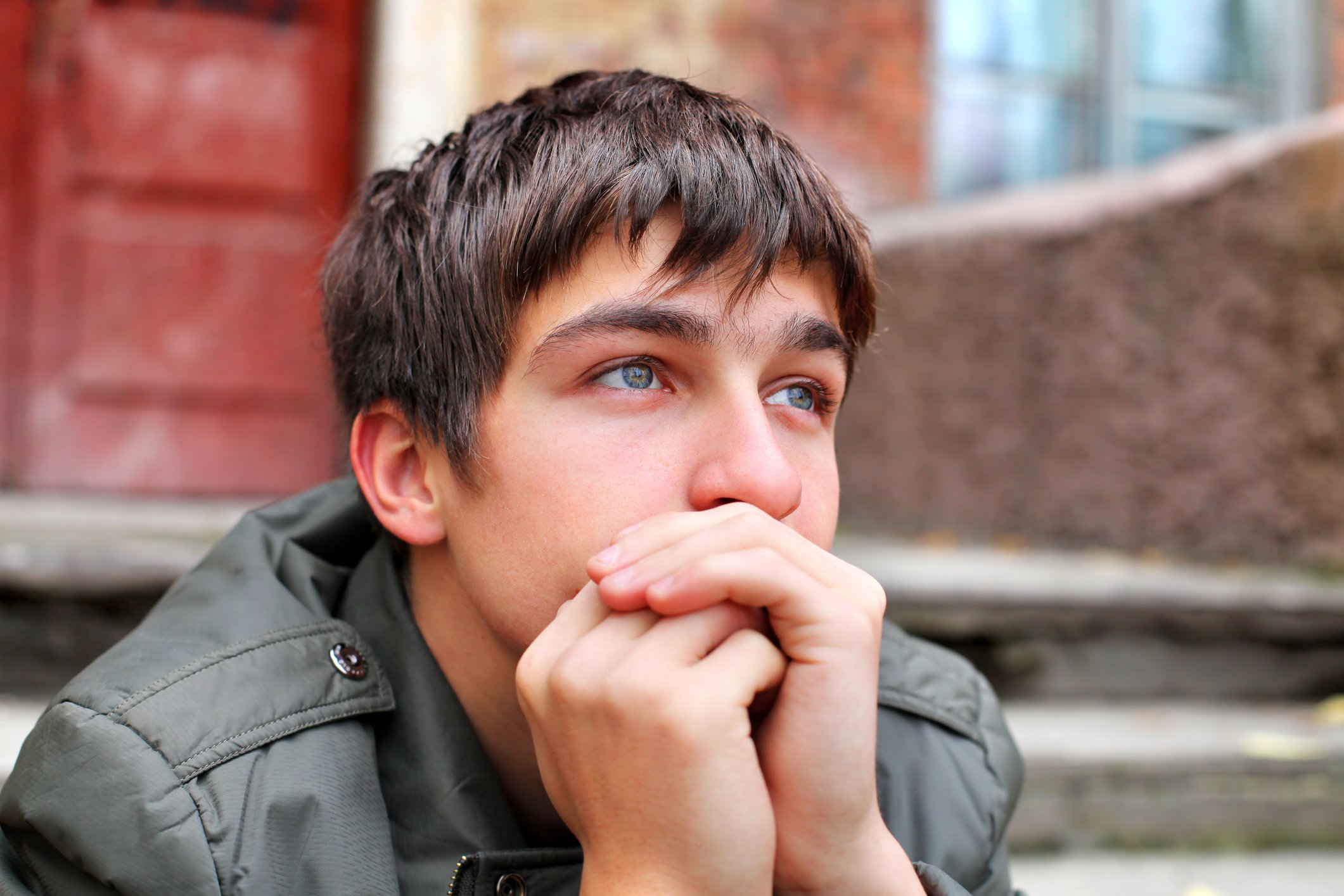 Young male deep in thought