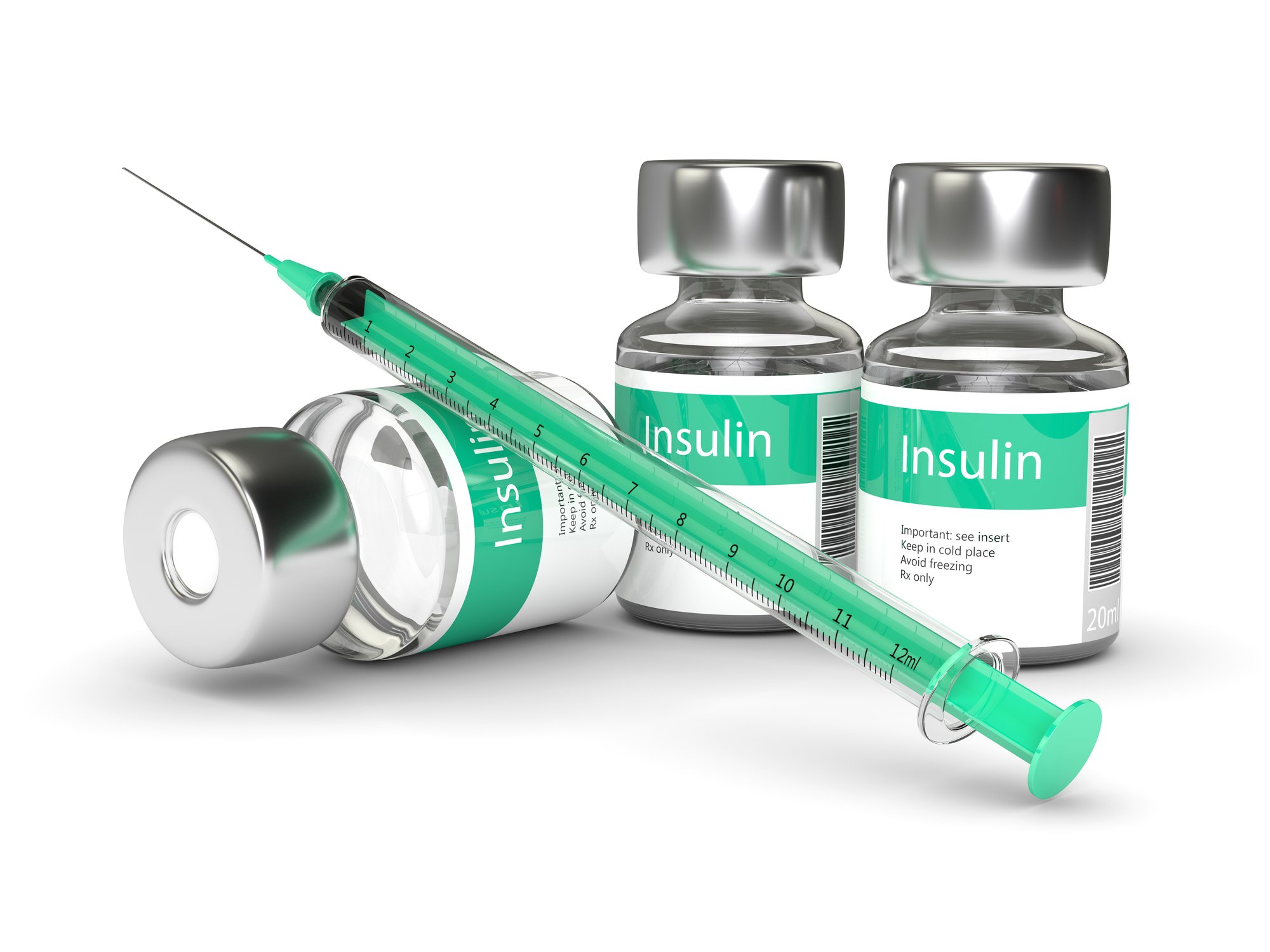 Insulin bottles and a syringe on a table