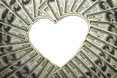 $100 bills forming heart