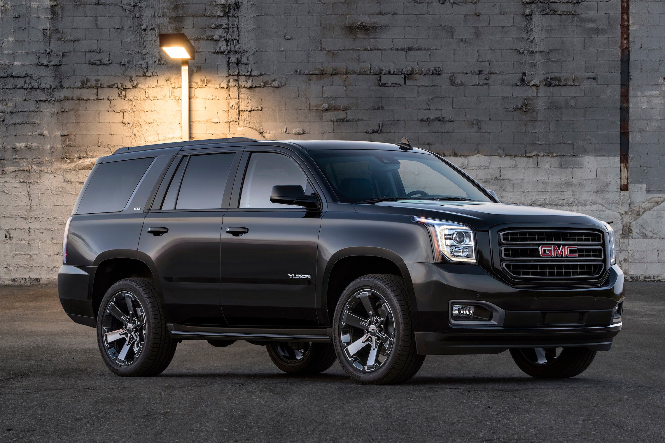 A black 2019 GMC Yukon, a big, upscale truck-based SUV. 