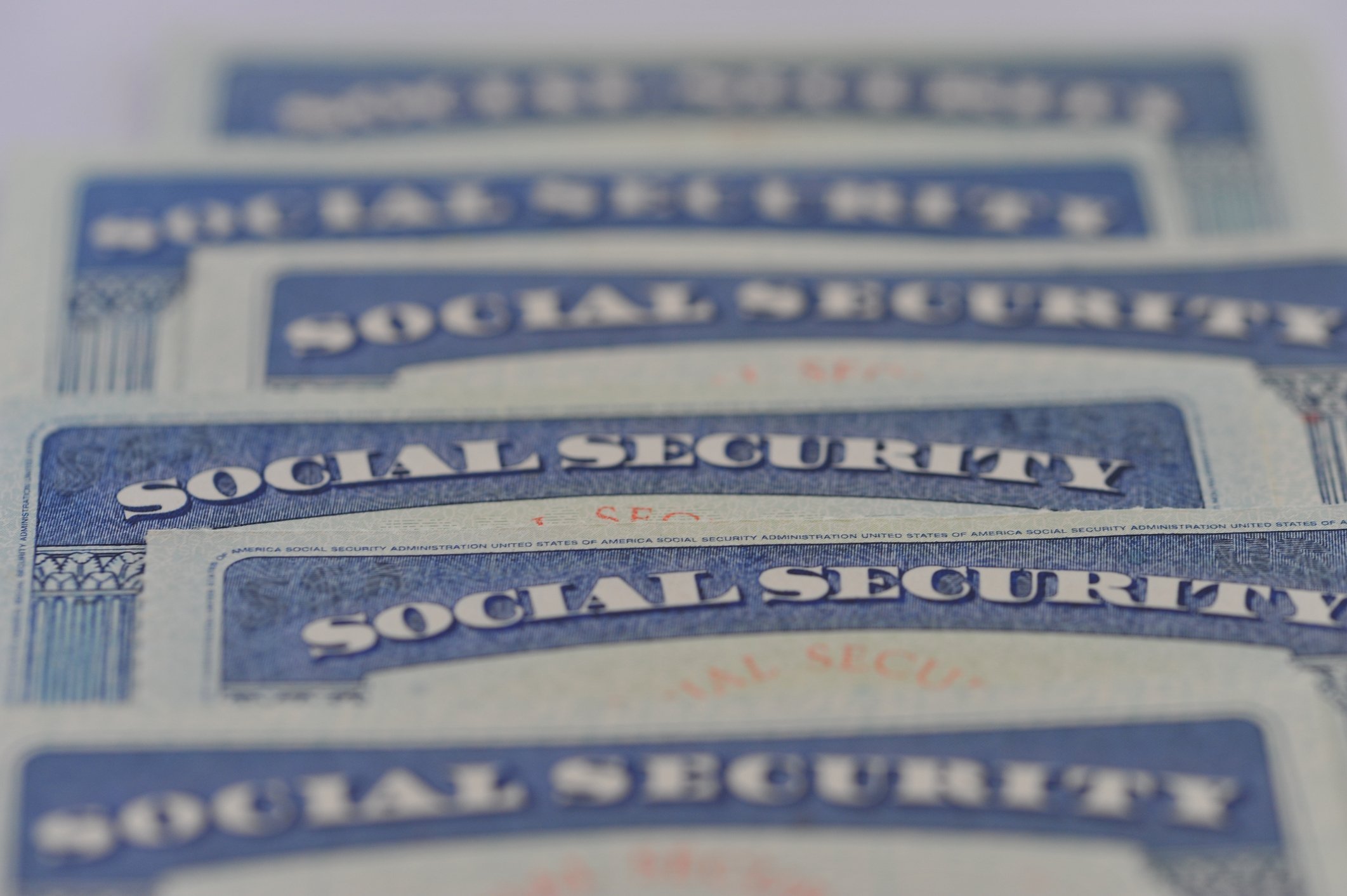 Social Security cards laid out on a table. 