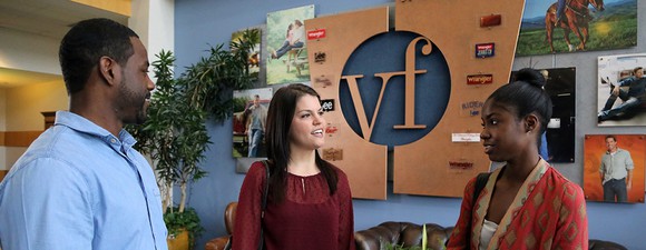 A group of employees interacting at the VF office