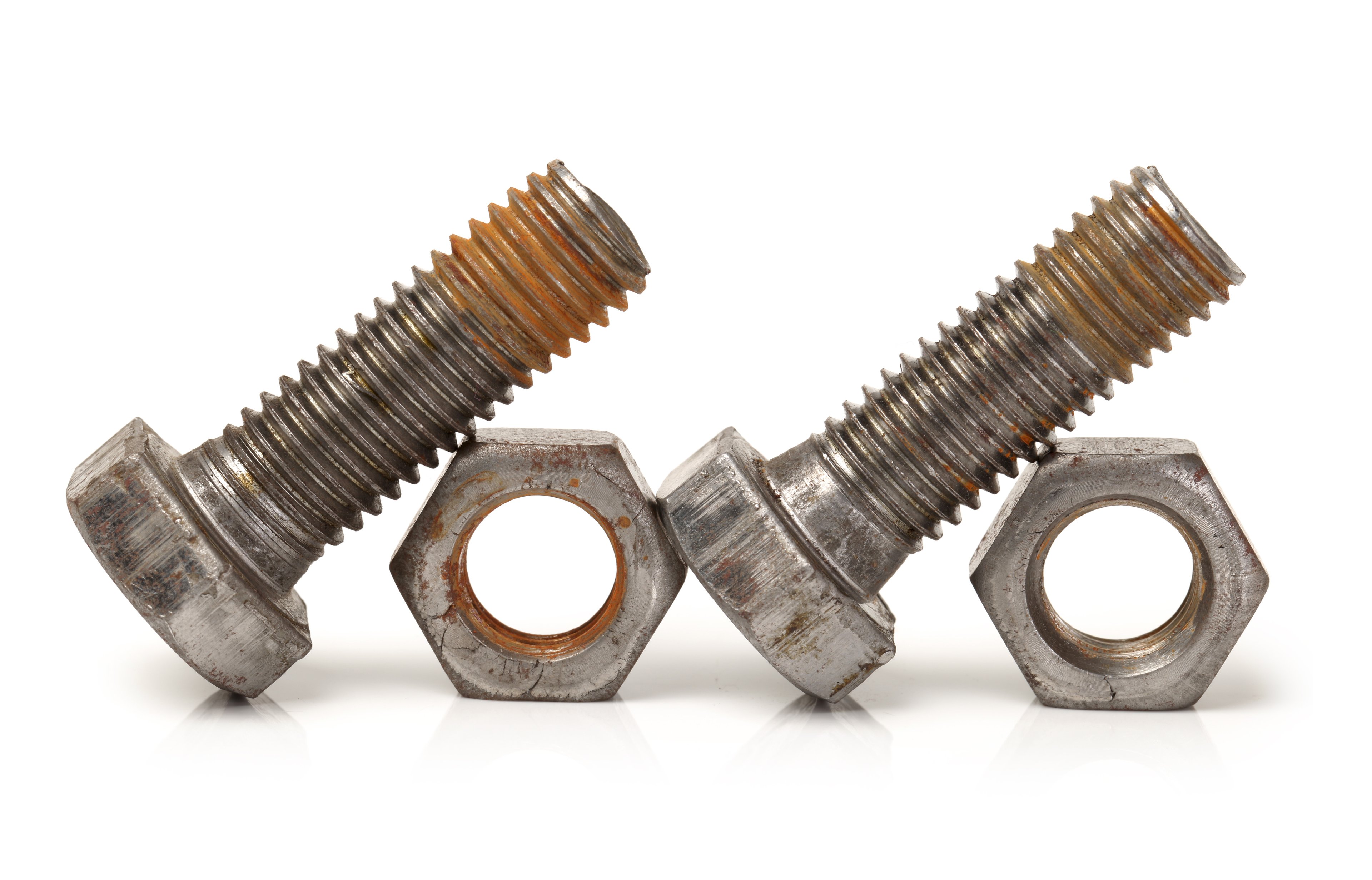 Two bolts leaning on two nuts
