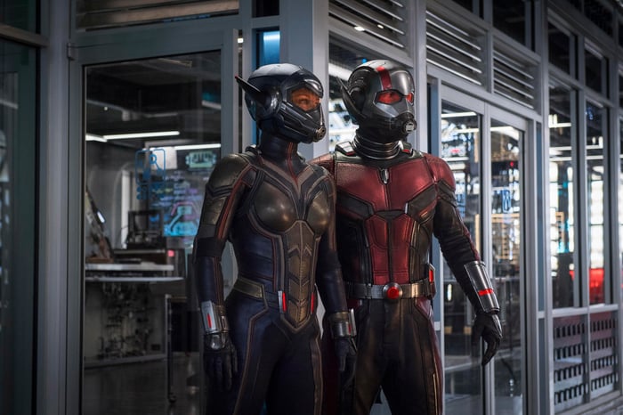Scene from Ant-Man and the Wasp, with the titular heroes in their respective costumes in front of a secured, metal and heavy glass room filled with computer equipment. 