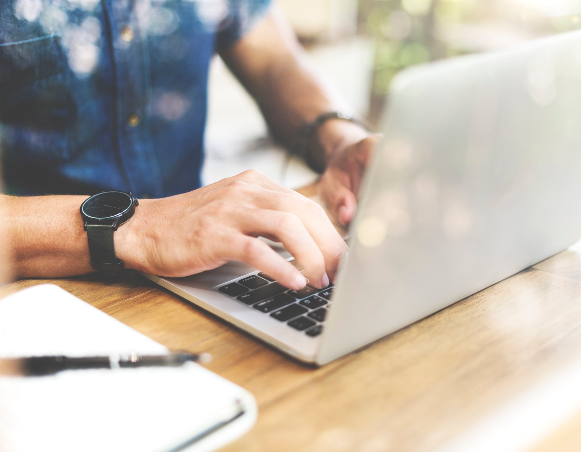 Man typing on a laptop