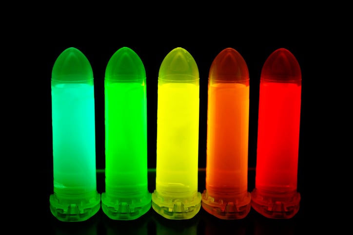 Quantum dot solutions tuned to various colors in test tubes.
