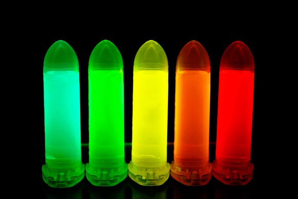 Quantum dot solutions tuned to various colors in test tubes.