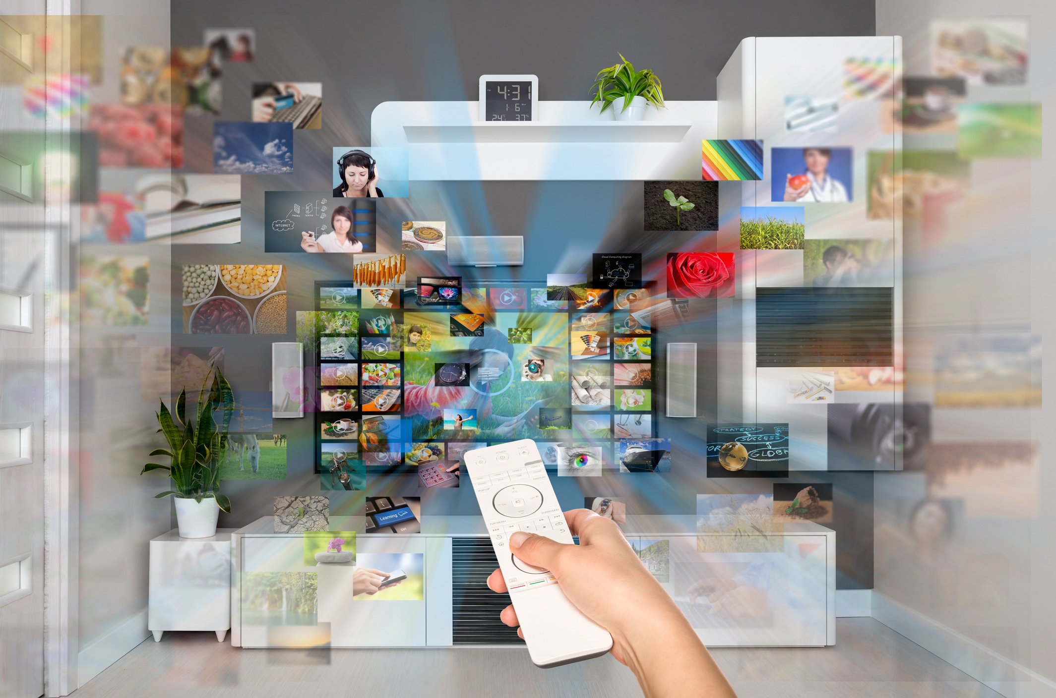 A hand pointing a remote at a TV with a checkerboard of viewing options, with images flying towards the viewer. 