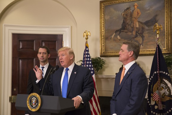 President Trump addressing reporters from behind the White House podium.