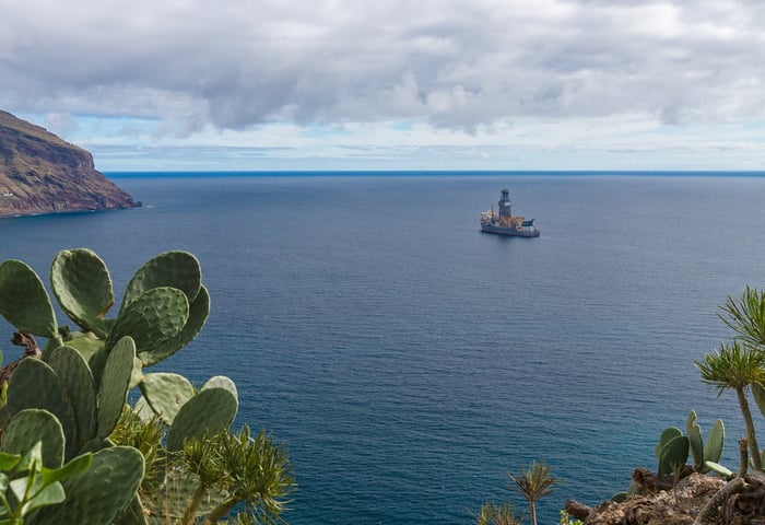 Offshore drilling rig on the water.